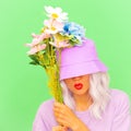 Funny hipster girl with flowers in trendy bucket hat.  Summer Kisses you Royalty Free Stock Photo