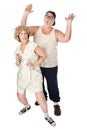 Funny Housewife Dancing in Front of Husband Royalty Free Stock Photo