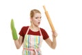 Funny housewife in kitchen apron holds baking rolling pin Royalty Free Stock Photo