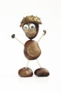 Funny human shape character or figurine made with chestnuts in w