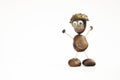 Funny human shape character or figurine made with chestnuts in white isolated background Royalty Free Stock Photo