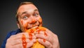 Fat man bites the tasty panini sandwich Royalty Free Stock Photo