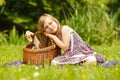 Funny hungry little girl having picnic in park Royalty Free Stock Photo