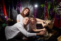 Funny huppy couple, young boy and big dog in the room decorated for Christmas. Family with father, mother and son with Royalty Free Stock Photo