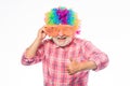 Funny idea. Crazy man in playful mood. mature bearded man in colorful wig and party glasses. anniversary holiday. happy