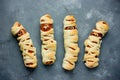 Funny idea for kids for Halloween food - sausage in dough as a m