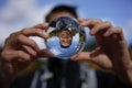 Funny image of asian man through a crystal ball Royalty Free Stock Photo