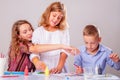 Funny image of happy children painting pictures. Art, education,  creativity and development concept Royalty Free Stock Photo