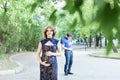 Funny image. Happy pregnant woman with husband standing together