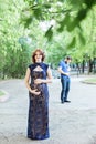 Funny image. Happy pregnant woman with husband standing together