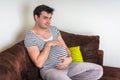 Funny image of pregnant man with pregnant belly Royalty Free Stock Photo