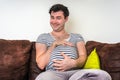 Funny image of pregnant man with pregnant belly Royalty Free Stock Photo