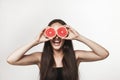 Funny image of young woman holding grapefruit Royalty Free Stock Photo