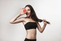 Funny image of young woman holding grapefruit Royalty Free Stock Photo