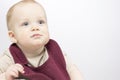Funny Infant baby posing in bib. Copy space. Studio shot Royalty Free Stock Photo