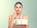 Funny joyful beauty model girl holding big beautiful party or birthday cake