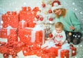 Funny kid baby with mom and Christmas gift. Christmas kids. Child with a Christmas present gift. Cute little kids