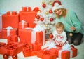 Funny kid baby with mom and Christmas gift. Christmas kids. Child with a Christmas present gift. Cute little kids