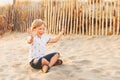 Funny kid boy resting on sand beach Royalty Free Stock Photo