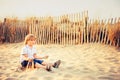 Funny kid boy resting on sand beach Royalty Free Stock Photo