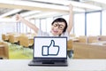 Funny kid in class with thumb up sign on laptop Royalty Free Stock Photo