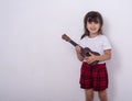 Funny kid girl with guitar, ukulele guitar.