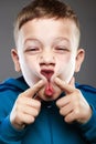 Funny kid. grimace face child Royalty Free Stock Photo