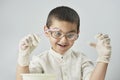 Funny kid making experiments at the workshop and exploring the world of chemistry