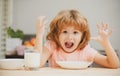 Funny kid with plate of soup. Child dinner. Best breakfast ever. Portrait of fun kid having healthy tasty snack. Small