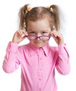 Funny kid putting on spectacles isolated