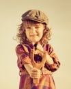 Funny kid shooting wooden slingshot Royalty Free Stock Photo