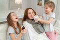 Funny kid treat patient mother, give medication