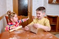 Funny kids bake cookies in kitchen. happy family Royalty Free Stock Photo