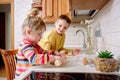 Funny kids bake cookies in kitchen. happy family Royalty Free Stock Photo