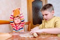 Funny kids bake cookies in kitchen. happy family Royalty Free Stock Photo