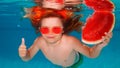 Funny kids boy with watermelon swim in the sea water. Child swimming underwater in swimming pool. Summer vacation with Royalty Free Stock Photo