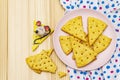 Funny kids cookies. Festive cheese crackers, New Year snack concept. Food, mouse sculpture, napkin. Wooden planks background