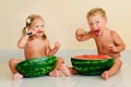 Funny kids eating watermelon