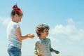 Funny kids playing with paints outdoor. Portrait of a cute kids painted in the colors of Holi festival. Royalty Free Stock Photo