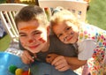 Funny kids with stained faces having fun at home in the kitchen. Brother and little sister. Funny. Creative concept. Mess at home Royalty Free Stock Photo