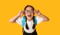 Funny Korean Schoolgirl Posing Having Fun On Yellow Background, Studio