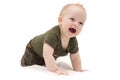 Funny laughing baby boy crawling on the white blanket against isolated white background Royalty Free Stock Photo