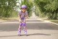 Funny laughing liberated girl rides roller skates Royalty Free Stock Photo