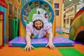 Funny laughing man like baby having fun in maze