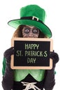 Funny Leprechaun girl holding a slate with text Happy St. PatrickÃÂ´s day