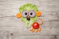 Funny lion made of vegetables on wooden table