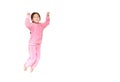 Funny little Asian child girl in pink tracksuit or sport cloth jumping on air over white background. Freedom kid movement concept Royalty Free Stock Photo