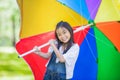 Funny little Asian girl with umbrella Royalty Free Stock Photo