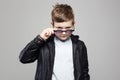 Funny little boy in hoodie and sunglasses Royalty Free Stock Photo