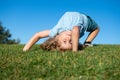 Funny little boy laying on the grass in the park. Royalty Free Stock Photo